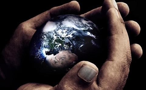 Hands holding globe