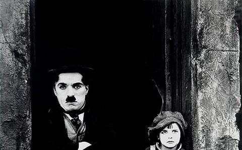 Charlie Chaplin in "The Kid"