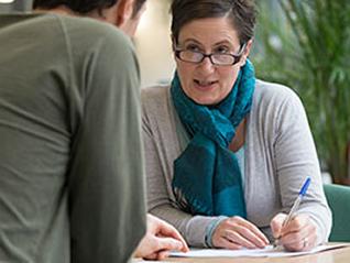 woman taking notes