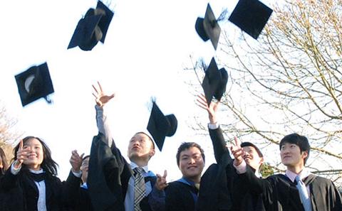 Graduates throwing hats