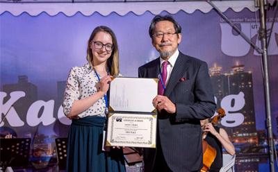 Jenny receiving the best student po
