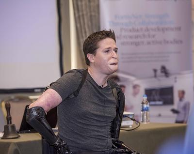 Alex Lewis presenting a personal pe