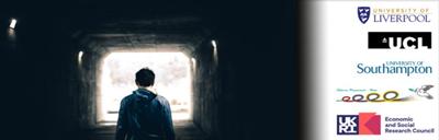 A man standing in an alley.