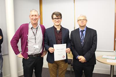Greg Ross receives his prize
