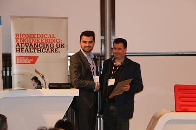 Joshua collecting his award