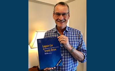 Steve Saxby holding his journal 