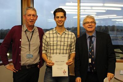 Dr Simon Lane receives his prize