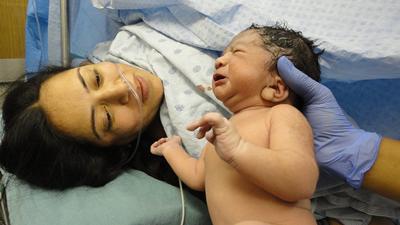 New born baby with mother