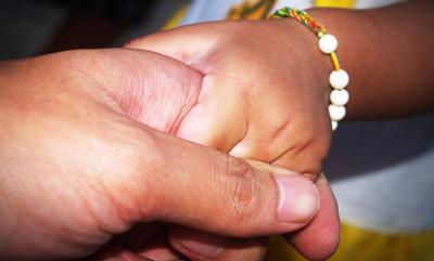 Child holding hands