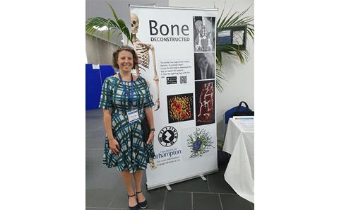 Patricia Goggin by her poster