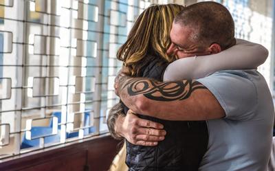Prisoner hugging loved one