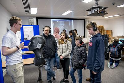 researcher engaging with a family