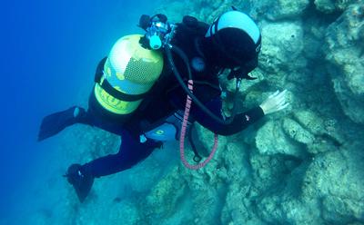 Diver in Roman marble quarry.