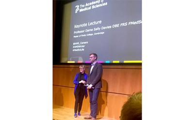 Dr Matt Loxham receives his award