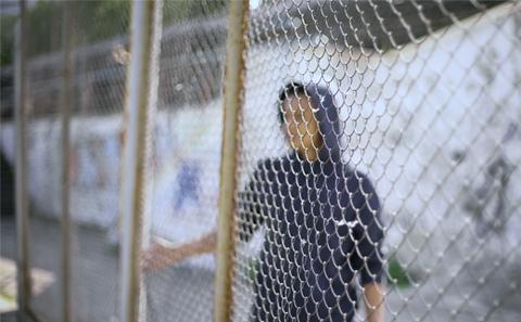 A person by a barrier