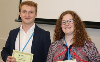 winners showing certificates