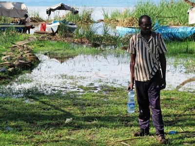 Fisherman holding a bottle of water