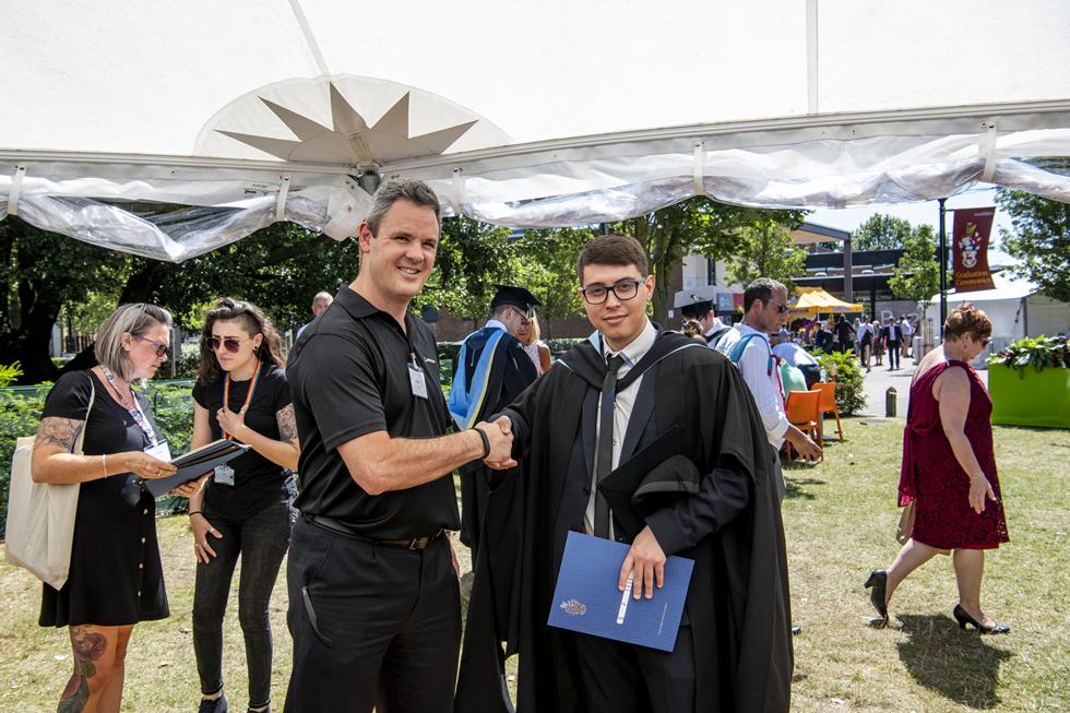 Student receiving graduation certificate  