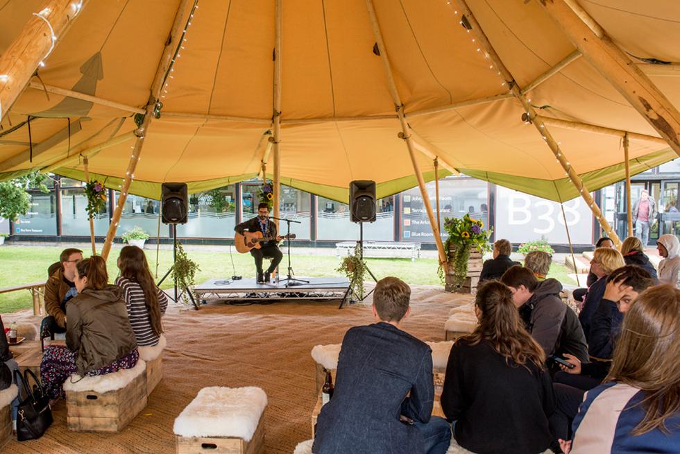 Staff enjoying a performance in the Tipi