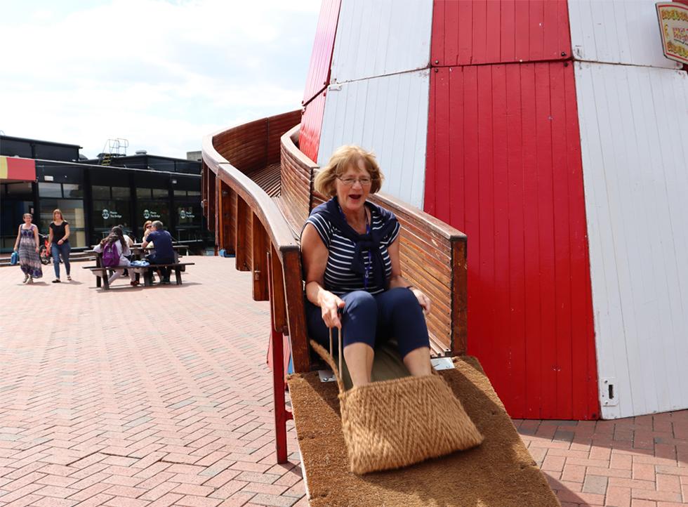 A member of staff having fun on the Helter Skelter 