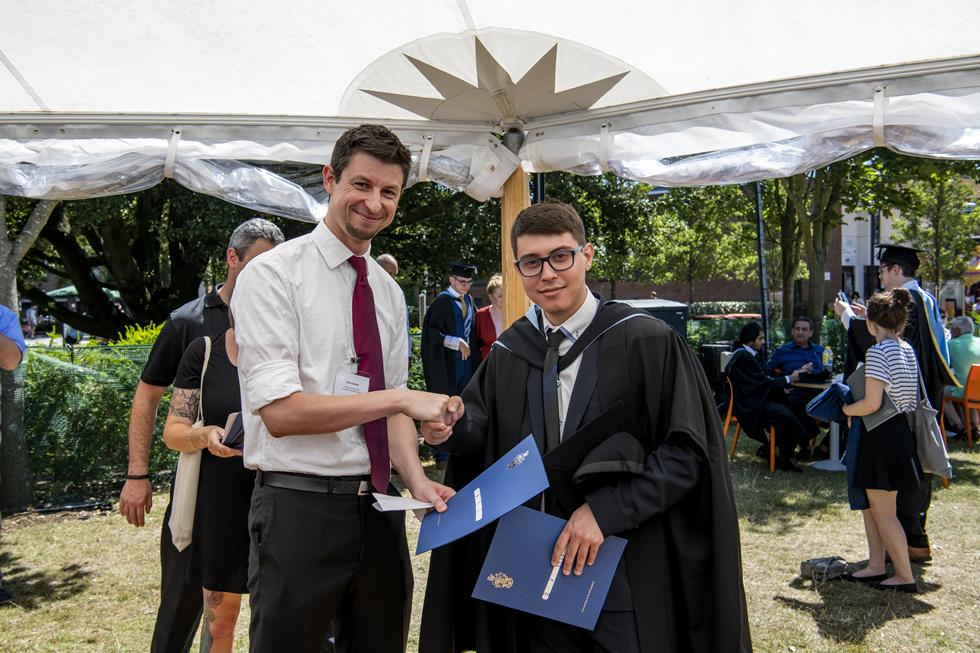 Student receiving graduation certificate  