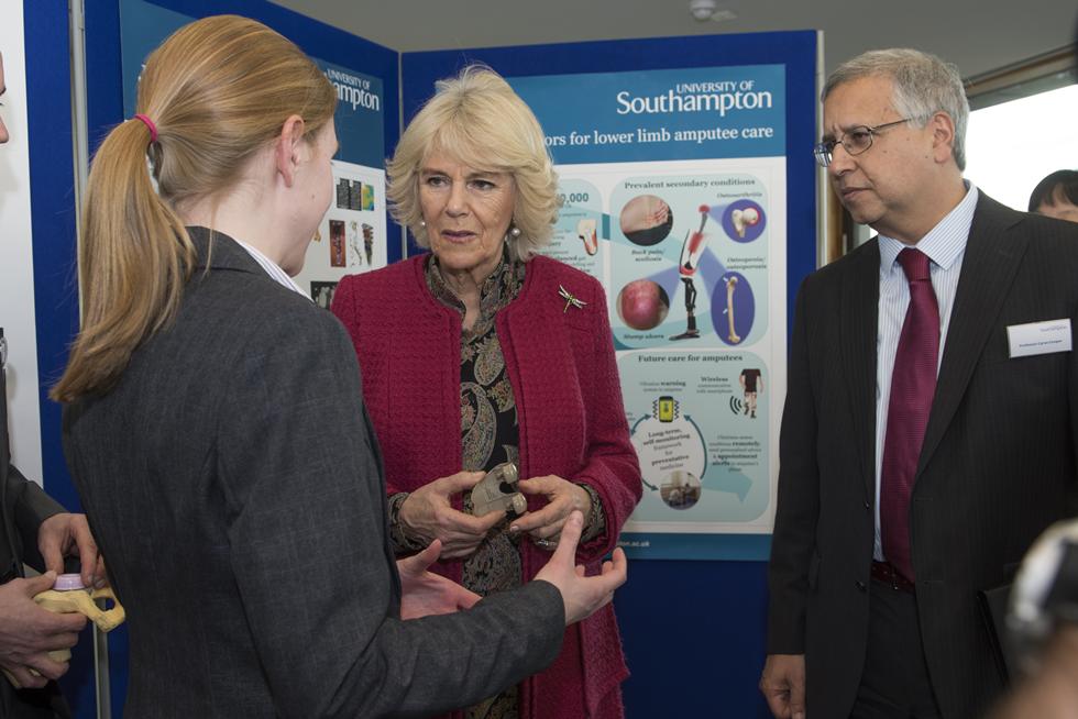 The Duchess of Cornwall talking with Katy Rankin and Professor Cyrus Cooper