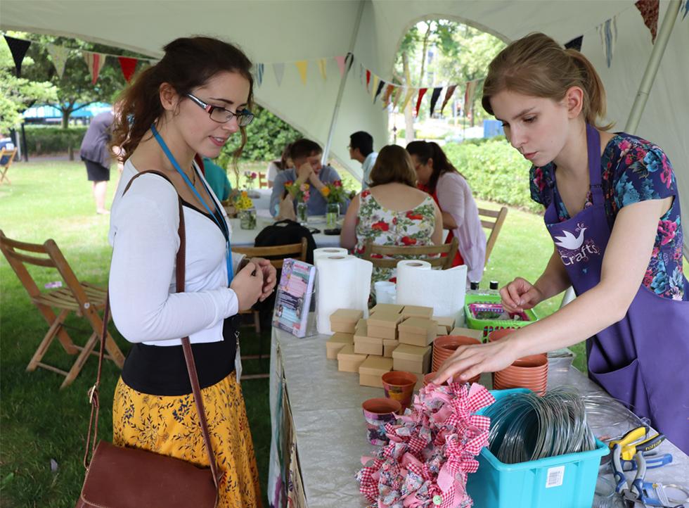 Staff member looking at the craft table