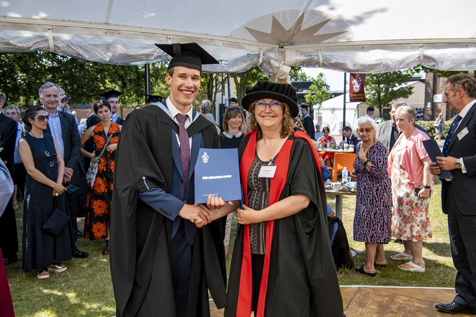 Student receiving graduation certificate  