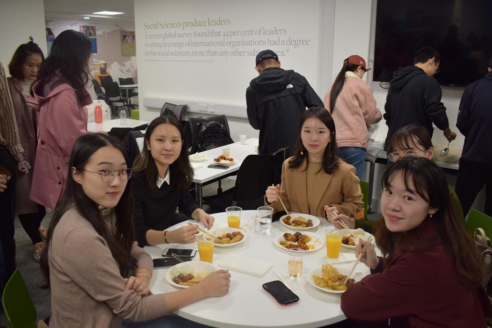 Students posing for photo at dinner