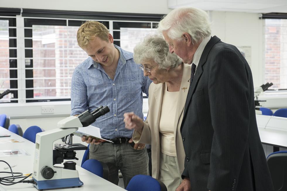 Laboratory technician Tom Bishop demonstrates equipment