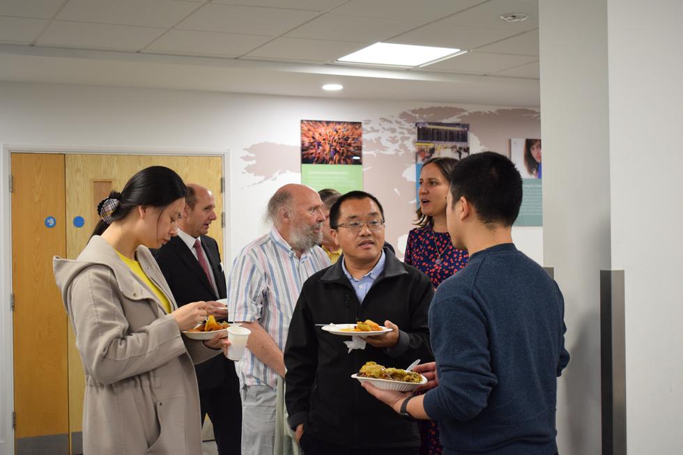 Staff eating and talking together