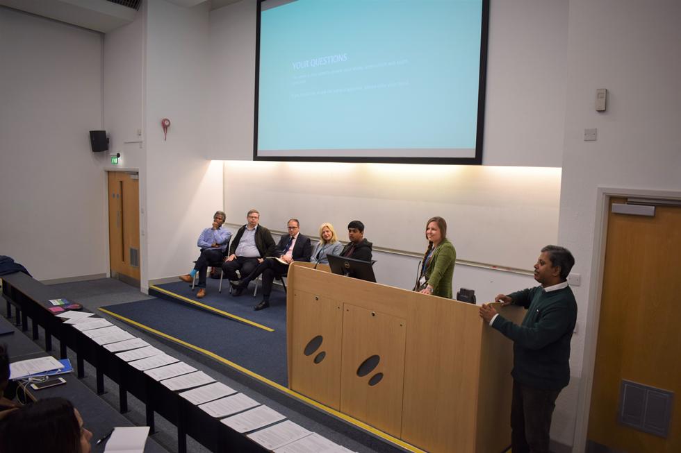 The panel taking questions from students