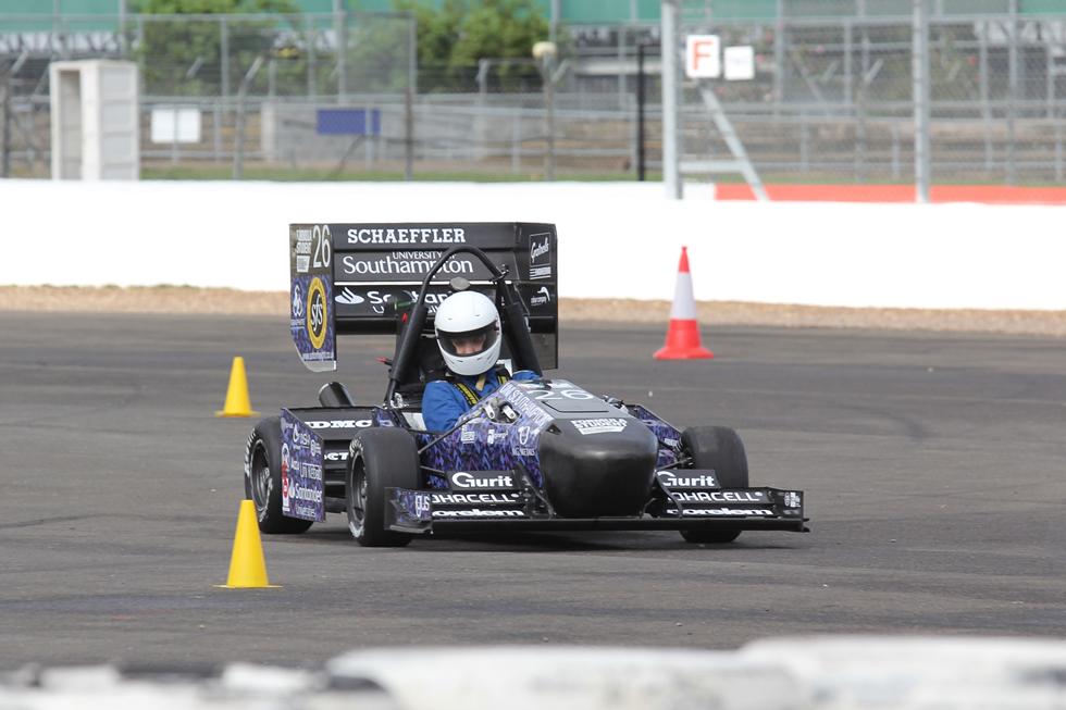 Race car speeding along the track