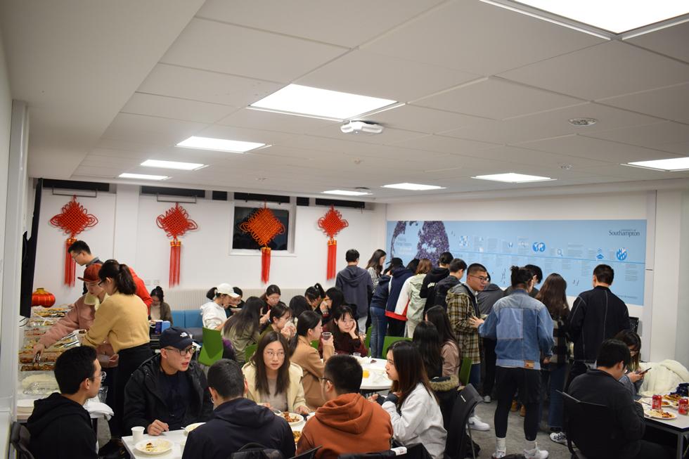 Students serving themselves buffet