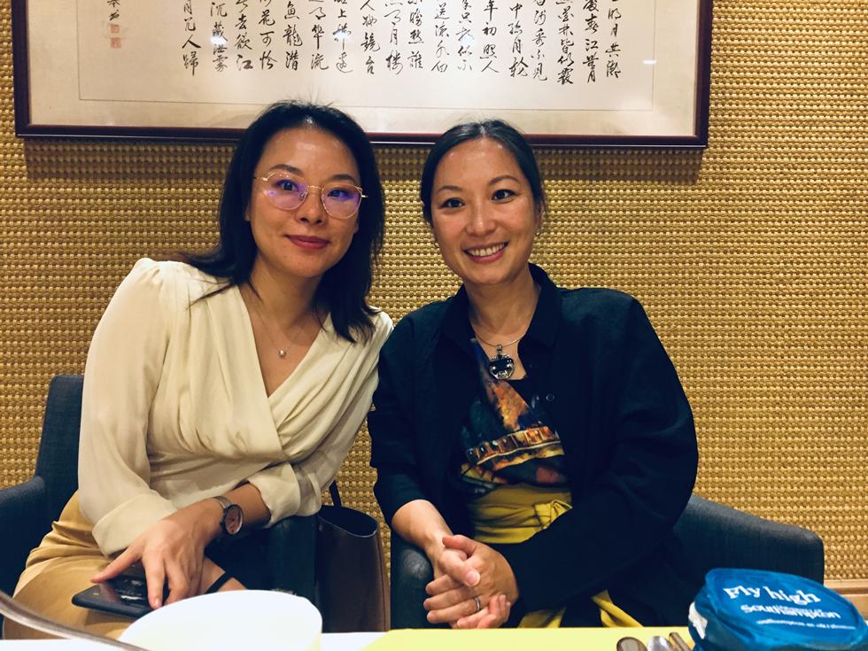 Song Pan Utz posing for photo with attendee