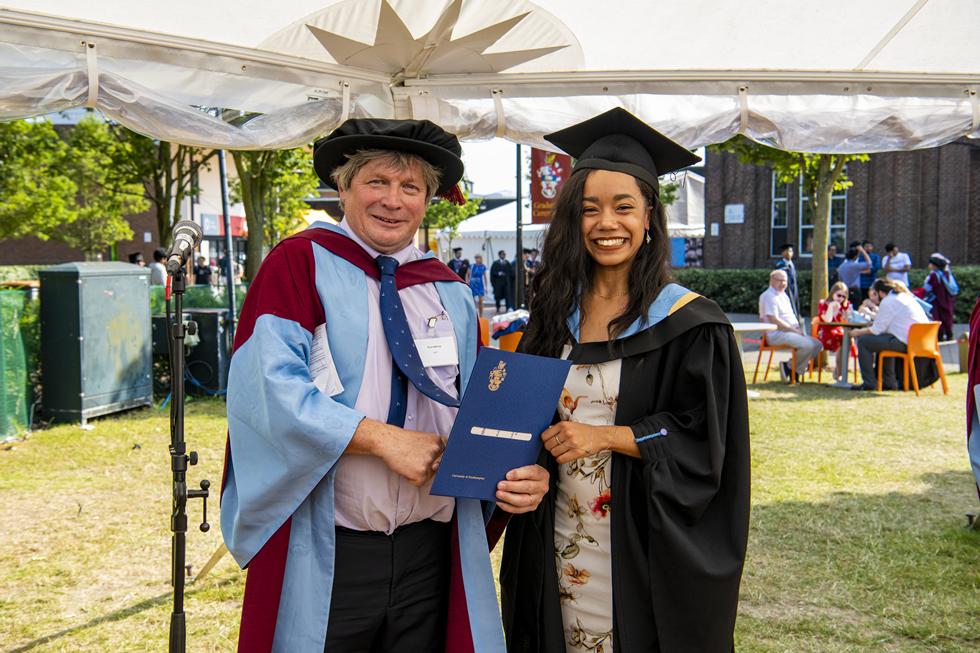 Student receiving graduation certificate  
