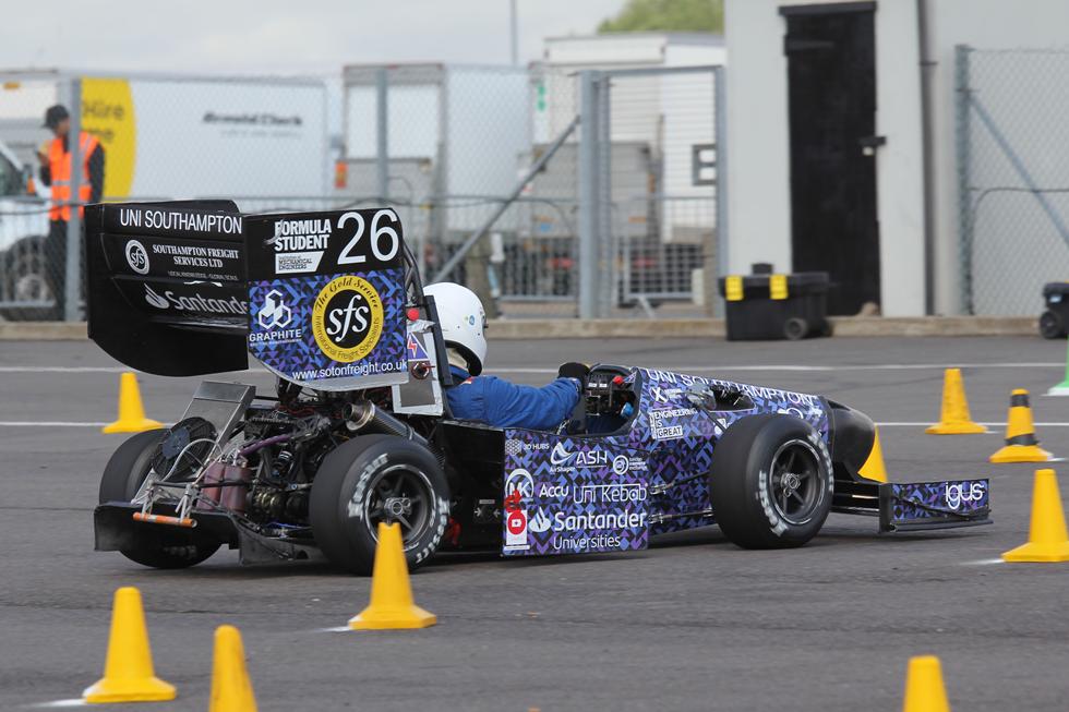 Race car going around the obstacles 