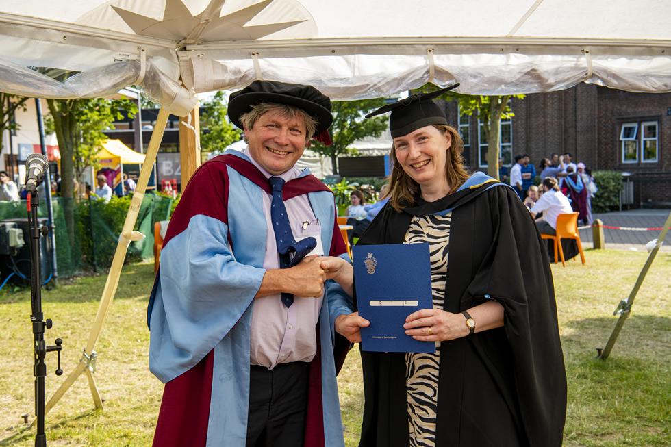 Student receiving graduation certificate  
