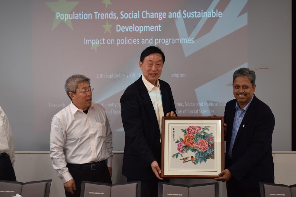 Prof Sabu Padmadas accepting gift
