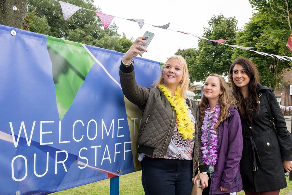 Staff posing for a photo at the Staff Party