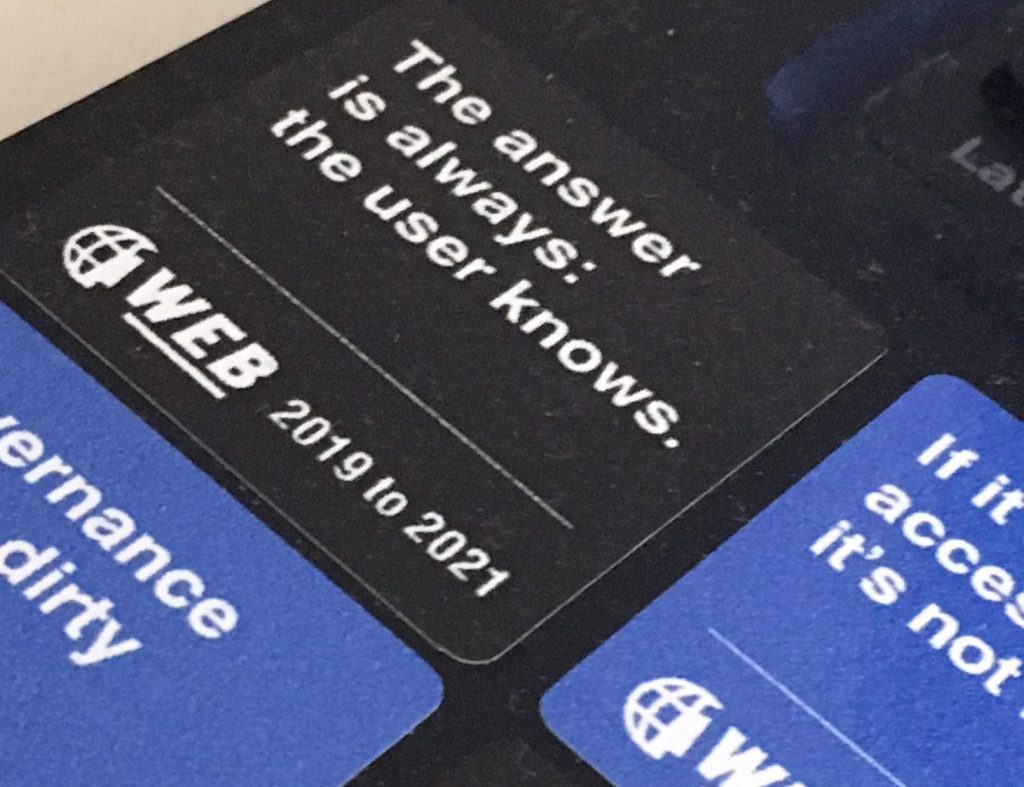 A OneWeb laptop sticker with the caption: 'The answer is always: the user knows statement'