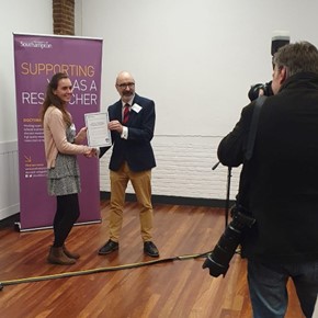 Receiving the Most Innovative Poster award at the Doctoral Research Poster Showcase