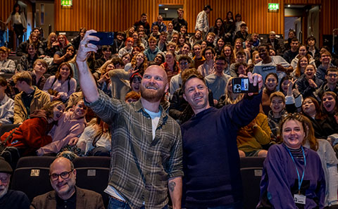 Crowd of students and guests posing