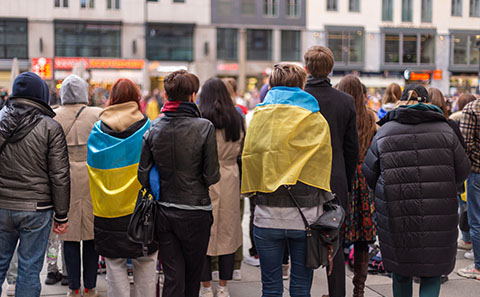 Crowd of people with Ukrainian flag