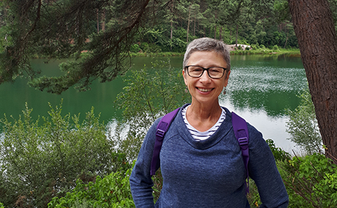 Woman in glasses, smiling