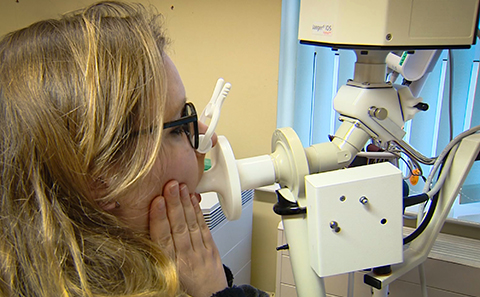 Woman blowing into testing machine