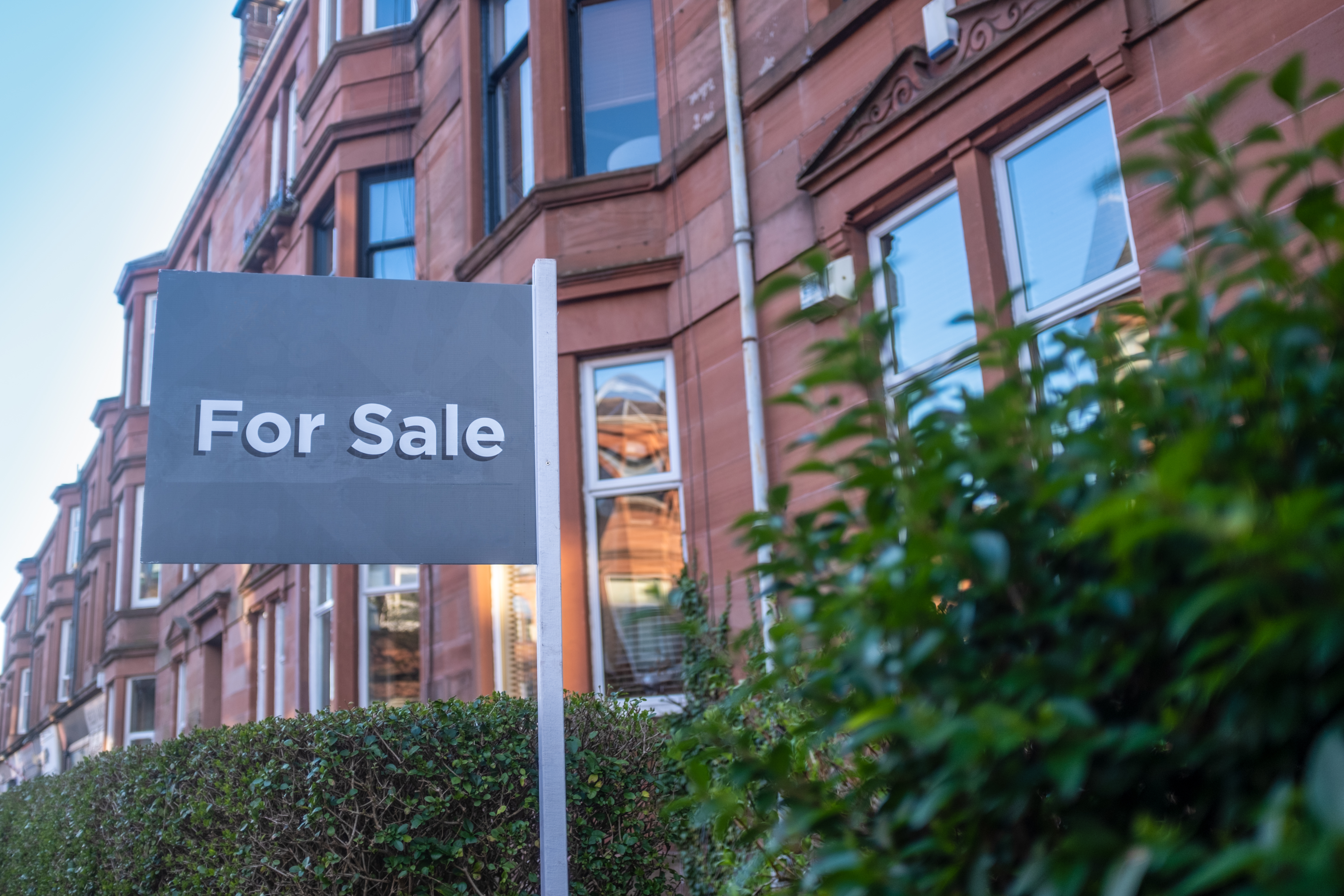 For sale sign outside property