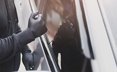 Someone trying to break into a car