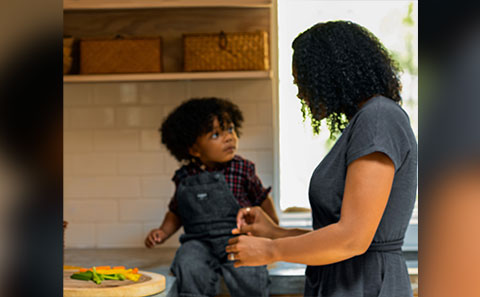 Mother and child preparing food