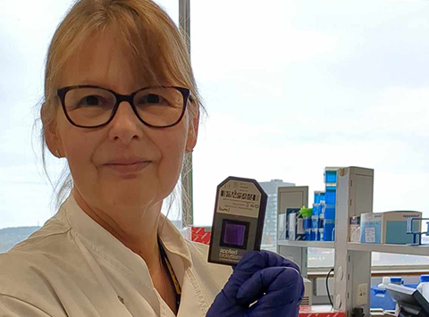 Female scientist holding chip